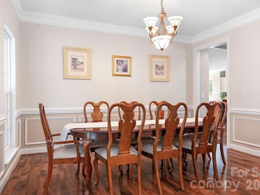157 Eclipse Way, Mooresville, NC 28117.  MLS# CAR4405597, YatesRealty ID 38166. Formal dining room looks over the front porch.
