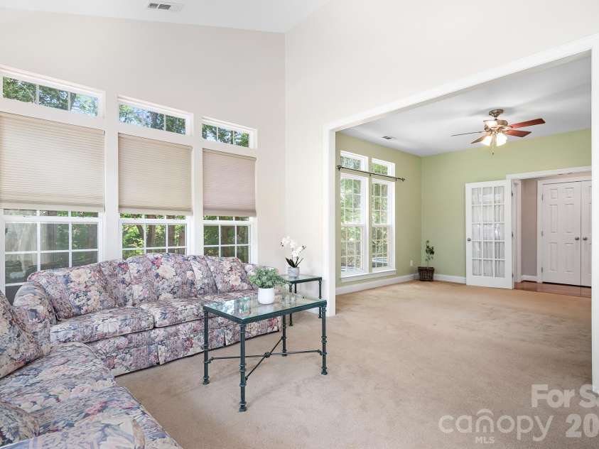 157 Eclipse Way, Mooresville, NC 28117.  MLS# CAR4405597, YatesRealty ID 38166. Lots of natural light flows through the sunroom and flex space.
