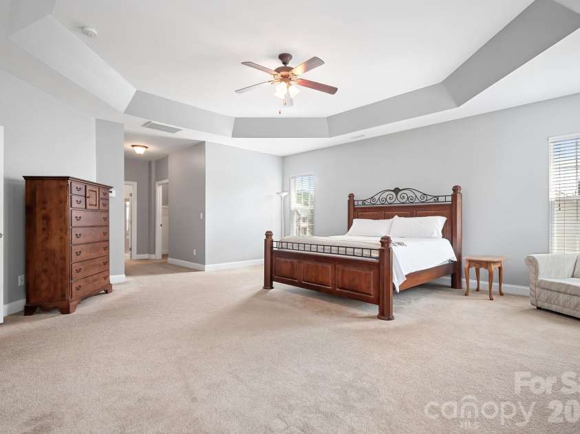157 Eclipse Way, Mooresville, NC 28117.  MLS# CAR4405597, YatesRealty ID 38166. Luxurious owners suite with tray ceiling.