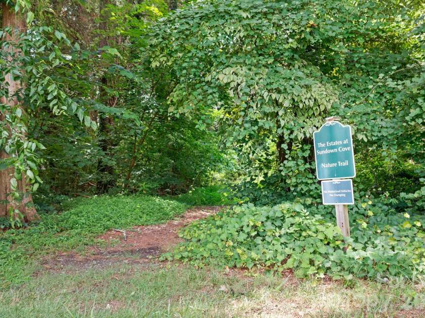 157 Eclipse Way, Mooresville, NC 28117.  MLS# CAR4405597, YatesRealty ID 38166. Natural walking trail to lake.
