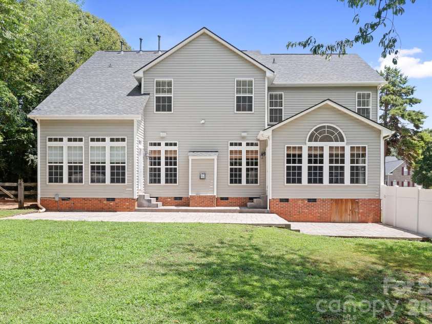 157 Eclipse Way, Mooresville, NC 28117.  MLS# CAR4405597, YatesRealty ID 38166. Privacy fencing at patio with gate.