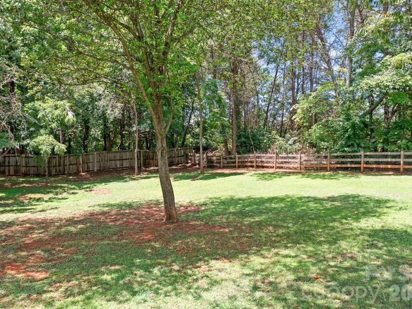 157 Eclipse Way, Mooresville, NC 28117.  MLS# CAR4405597, YatesRealty ID 38166. Shaded, private, fenced, backyard.