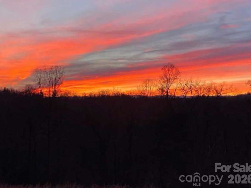3430 Tranquil Hills Drive, Lenoir, NC 28645.  MLS# CAR4402608, YatesRealty ID 38174. Fire Sunset