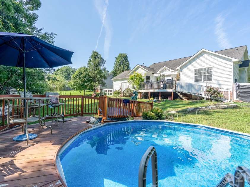 106 Quarry Way, Salisbury, NC 28146.  MLS# CAR4405112, YatesRealty ID 38177. Outdoor above ground pool with deck and stairs.