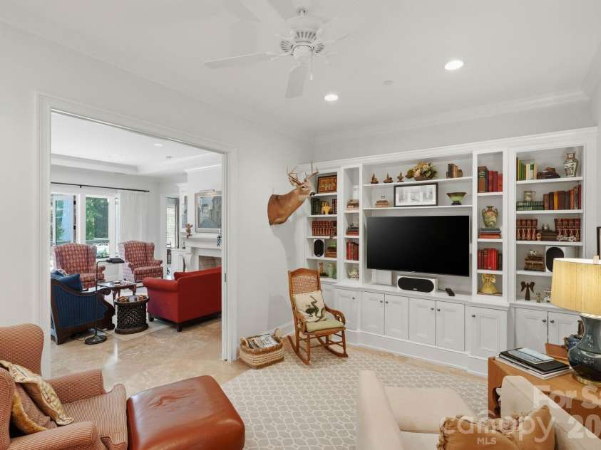 229 Church Street, Charlotte, NC 28202.  MLS# CAR4381312, YatesRealty ID 3818. Versatile secondary living space featuring custom built ins and designer details throughout. Perfect as a media room, office, library, or private retreat.