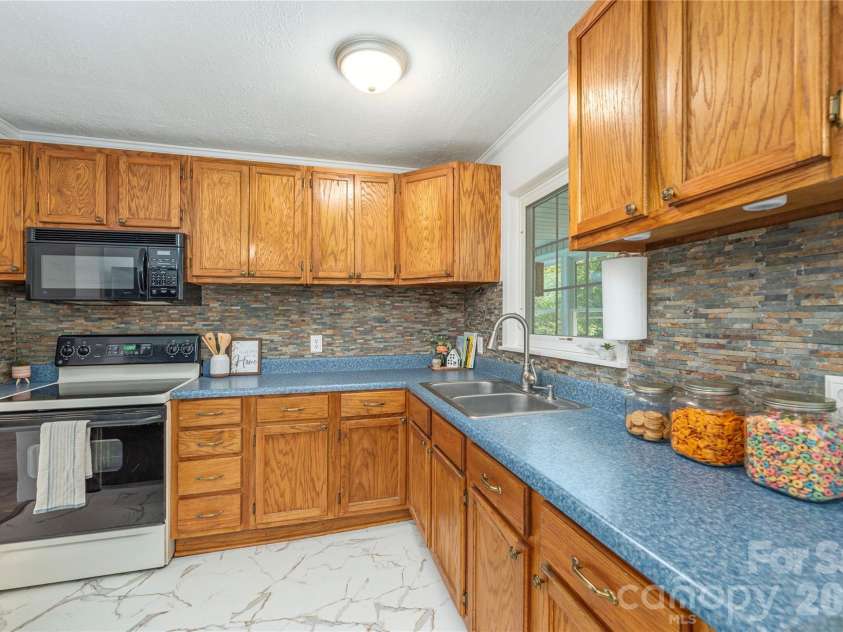 881 Mulberry Street, Clyde, NC 28721.  MLS# CAR4398802, YatesRealty ID 38191. 
