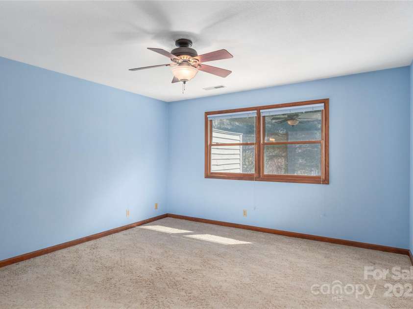 30 Cedarcliff Circle, Asheville, NC 28803.  MLS# CAR4235579, YatesRealty ID 3820. Bright primary bedroom.
