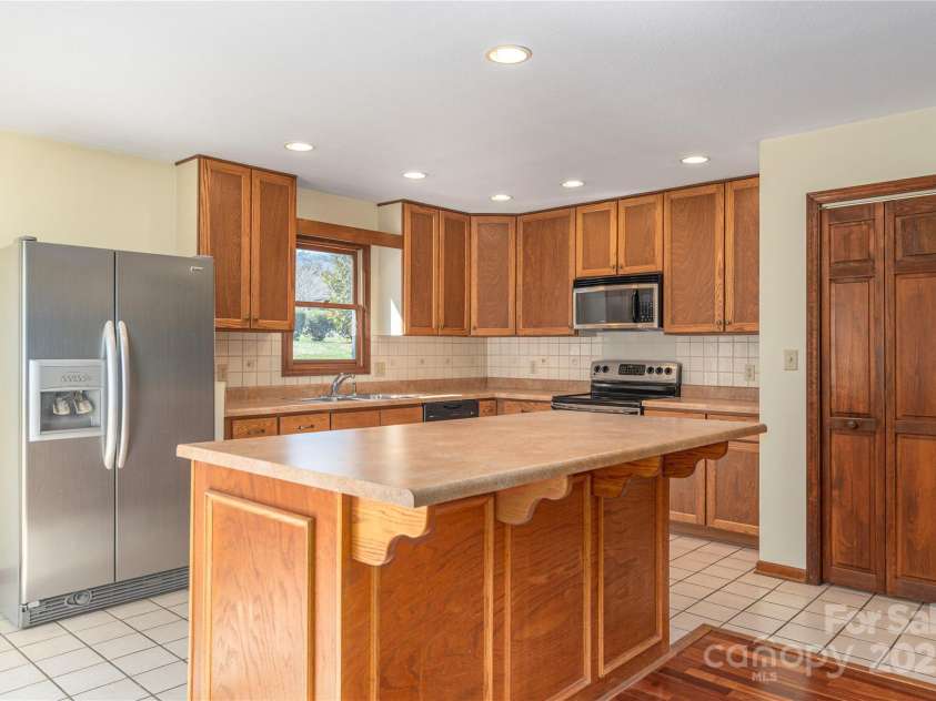 30 Cedarcliff Circle, Asheville, NC 28803.  MLS# CAR4235579, YatesRealty ID 3820. Large kitchen island perfect for entertaining.