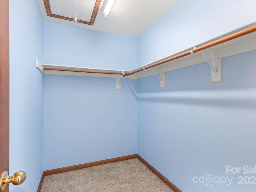 30 Cedarcliff Circle, Asheville, NC 28803.  MLS# CAR4235579, YatesRealty ID 3820. Large walk-in closet in primary bedroom.