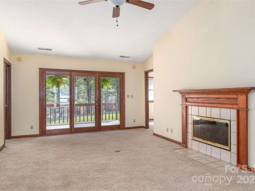 30 Cedarcliff Circle, Asheville, NC 28803.  MLS# CAR4235579, YatesRealty ID 3820. Living room looking out onto back deck.