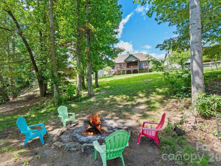 36 Copper Mill Court, Candler, NC 28715.  MLS# CAR4396335, YatesRealty ID 38225. Fire Pit looking back towards the home
