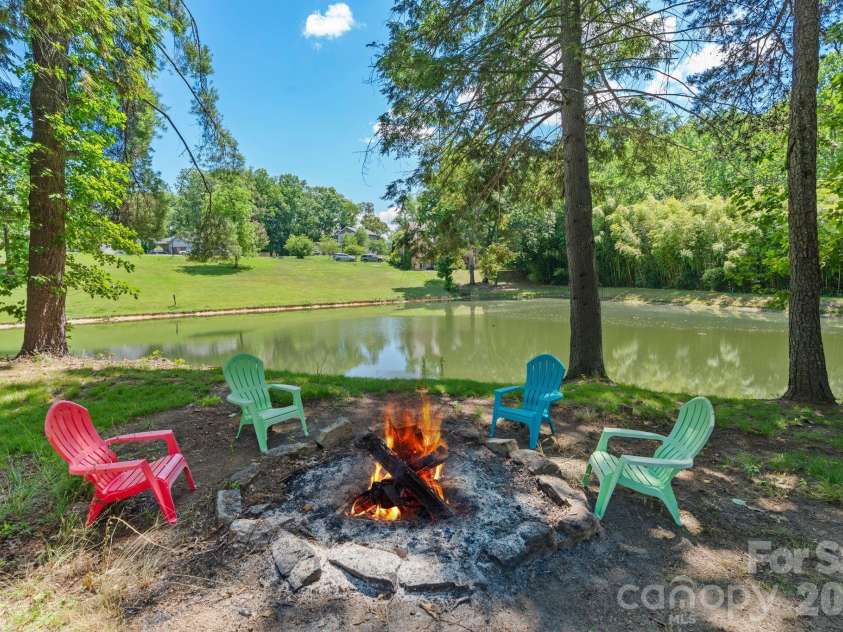 36 Copper Mill Court, Candler, NC 28715.  MLS# CAR4396335, YatesRealty ID 38225. Firepit overlooking lower pond