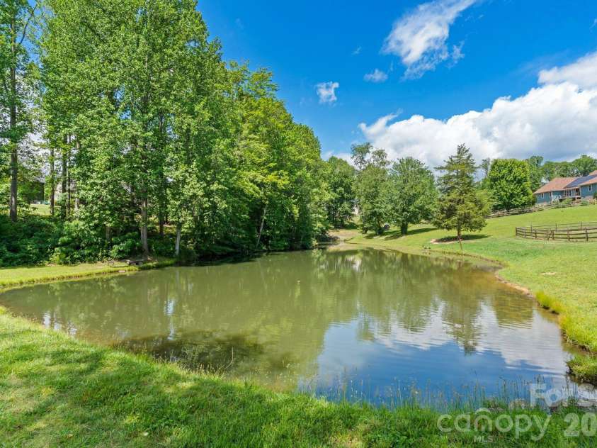 36 Copper Mill Court, Candler, NC 28715.  MLS# CAR4396335, YatesRealty ID 38225. Upper Pond