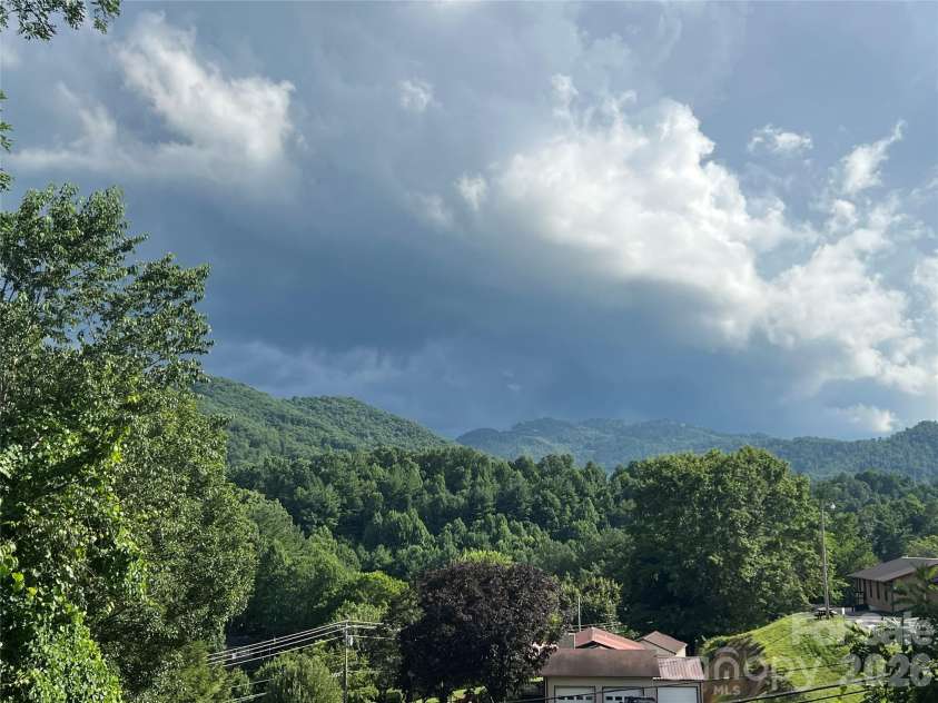 530 West Side Road, Burnsville, NC 28714.  MLS# CAR4403042, YatesRealty ID 38233. Year round mountain views from back partially covered deck.