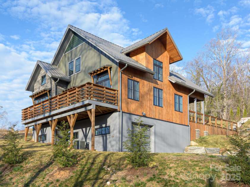 147 Abundance Run, Asheville, NC 28805.  MLS# CAR4240890, YatesRealty ID 3824. Large deck facing Old Haw Creek Rd side of property.