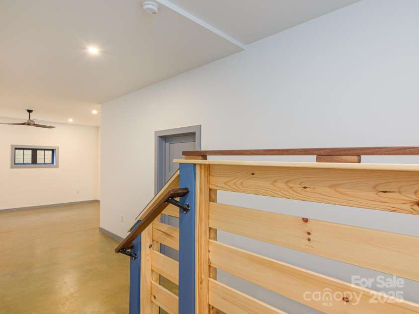 147 Abundance Run, Asheville, NC 28805.  MLS# CAR4240890, YatesRealty ID 3824. Stairs leading to Basement and open room.