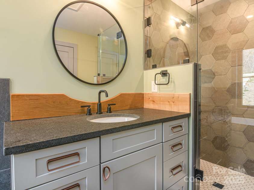 147 Abundance Run, Asheville, NC 28805.  MLS# CAR4240890, YatesRealty ID 3824. Vanity in Master ensuite