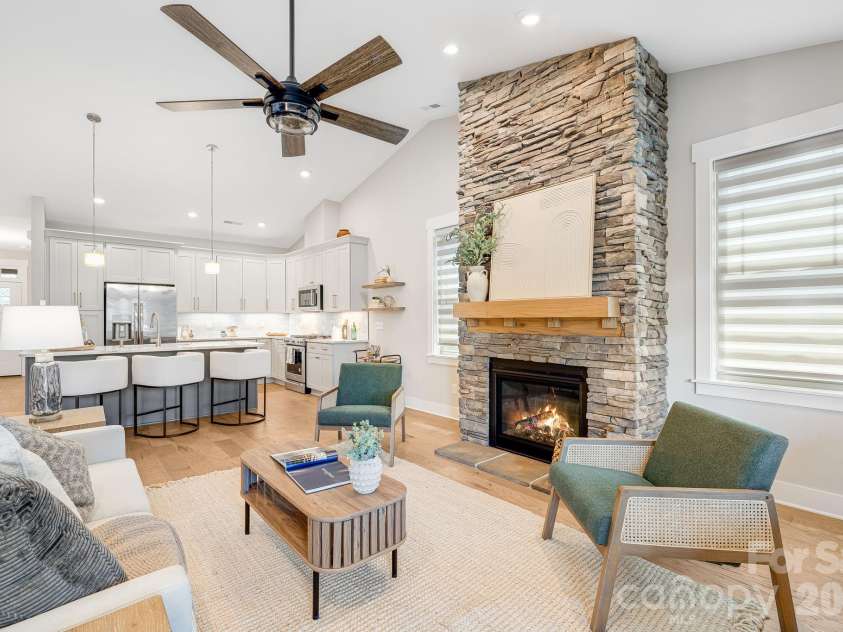 158 Waightstill Drive, Arden, NC 28704.  MLS# CAR4387914, YatesRealty ID 38246. An inviting gathering space enhanced by soaring ceilings and seamless flow into the dining area and kitchen.