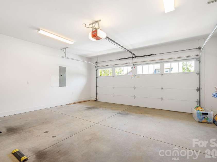 158 Waightstill Drive, Arden, NC 28704.  MLS# CAR4387914, YatesRealty ID 38246. Attached two-car garage with ample space for parking, storage, and everyday convenience.