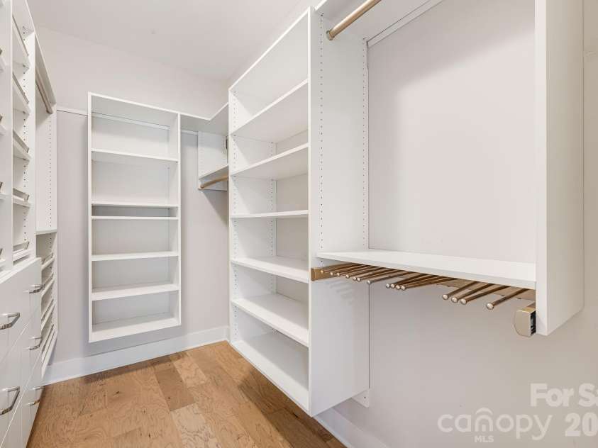 158 Waightstill Drive, Arden, NC 28704.  MLS# CAR4387914, YatesRealty ID 38246. Custom walk-in closet with built-in shelving and organization system