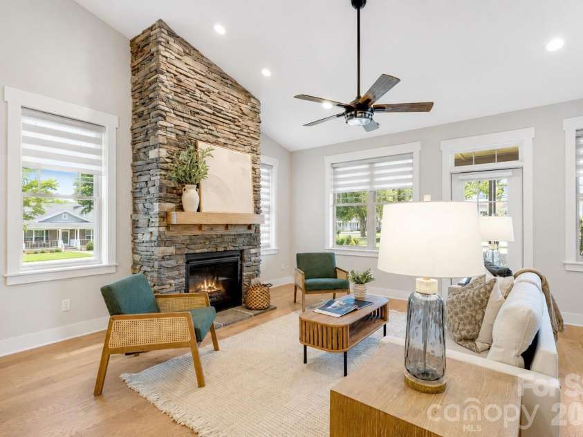 158 Waightstill Drive, Arden, NC 28704.  MLS# CAR4387914, YatesRealty ID 38246. Soaring ceilings, abundant natural light, and a dramatic stone fireplace create an inviting gathering space.