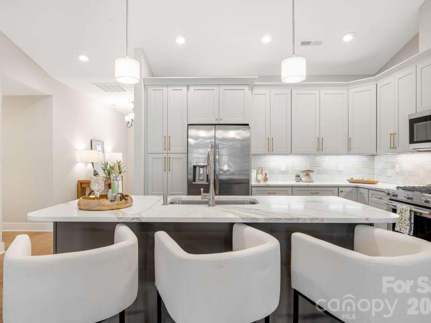 158 Waightstill Drive, Arden, NC 28704.  MLS# CAR4387914, YatesRealty ID 38246. Thoughtfully designed for both entertaining and everyday living, the open kitchen offers exceptional flow and functionality