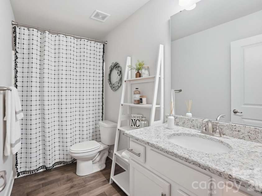 11765 Glenwood Drive, Locust, NC 28097.  MLS# CAR4373388, YatesRealty ID 38249. Upstairs Bath