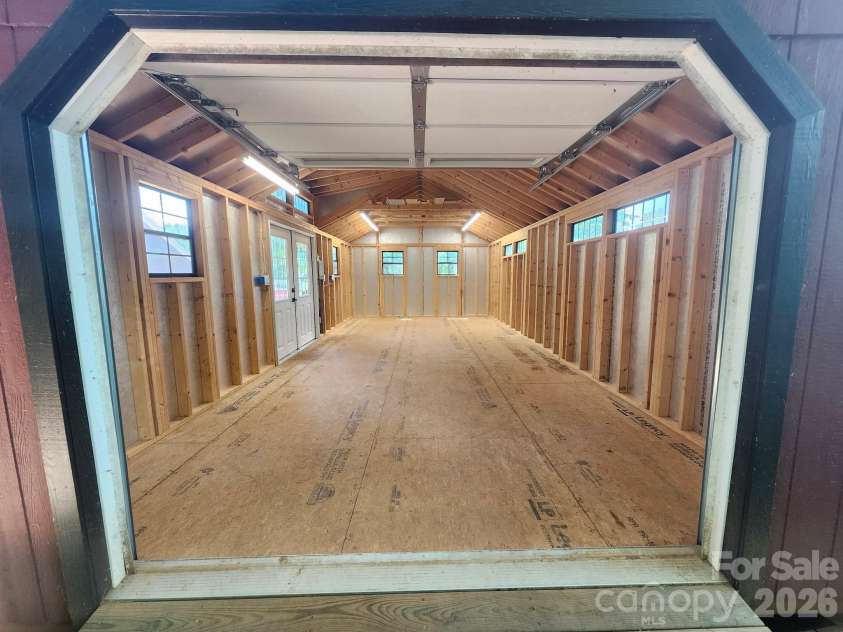 10846 Tyler Brook Lane, Mint Hill, NC 28227.  MLS# CAR4392416, YatesRealty ID 38253. Inside Workshop Shed