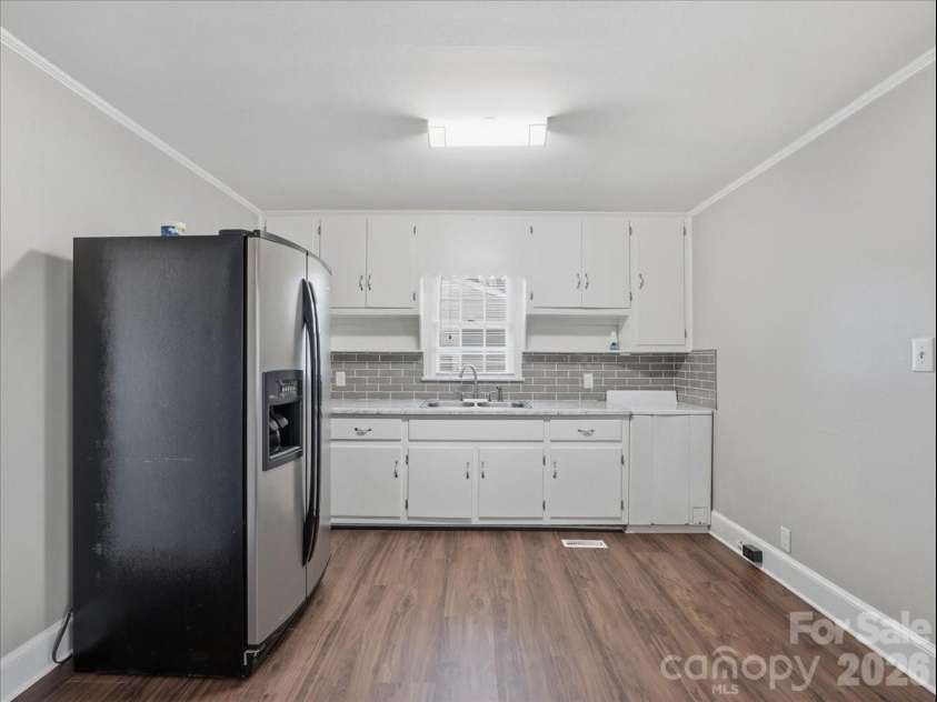 702 Rockwood Drive, Rock Hill, SC 29730.  MLS# CAR4364183, YatesRealty ID 38257. Wood cabinets and back splash