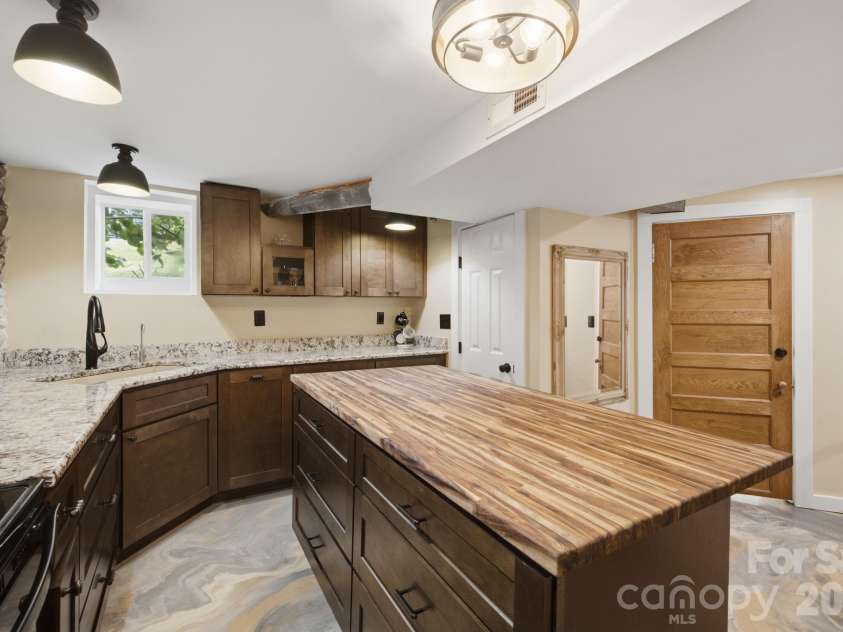 108 Patton Avenue, Canton, NC 28716.  MLS# CAR4400463, YatesRealty ID 38266. Downstairs Kitchen