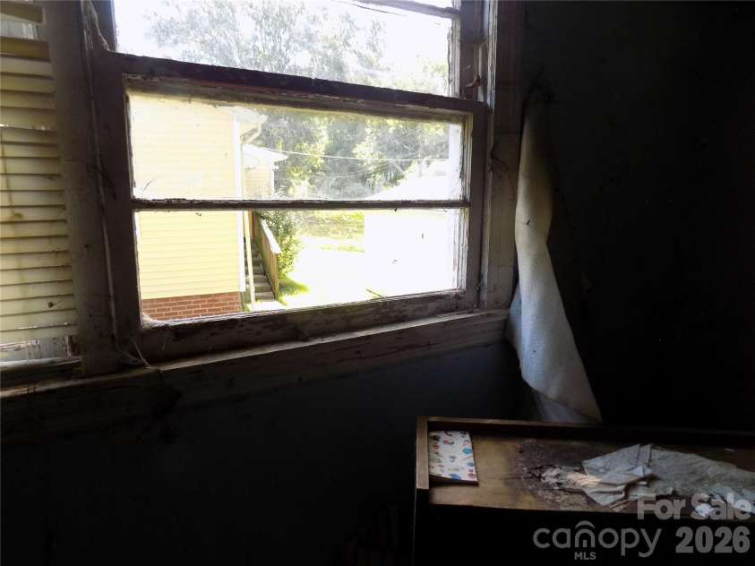 1013 Sixth Avenue, Gastonia, NC 28052.  MLS# CAR4403830, YatesRealty ID 38274. BROKEN WINDOW