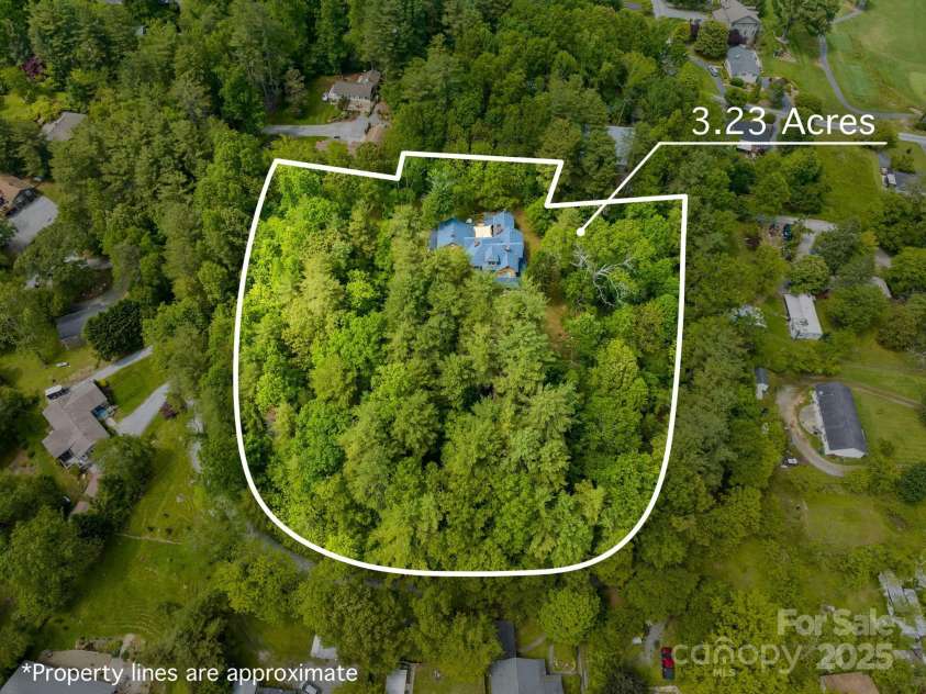 305 Ficker Circle, Hendersonville, NC 28739.  MLS# CAR4240043, YatesRealty ID 3831. 3+ mostly level acreage (approx boundary lines)