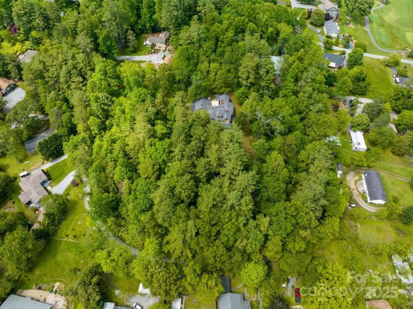 305 Ficker Circle, Hendersonville, NC 28739.  MLS# CAR4240043, YatesRealty ID 3831. All of this on 3+ private, wooded acres...