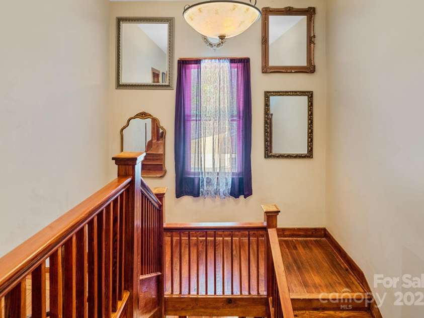 305 Ficker Circle, Hendersonville, NC 28739.  MLS# CAR4240043, YatesRealty ID 3831. Grand staircase to second floor.