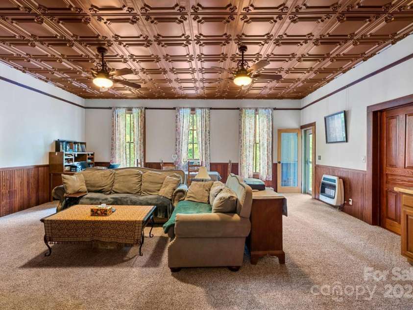 305 Ficker Circle, Hendersonville, NC 28739.  MLS# CAR4240043, YatesRealty ID 3831. Large living room with spectacular tin ceiling, recently installed.