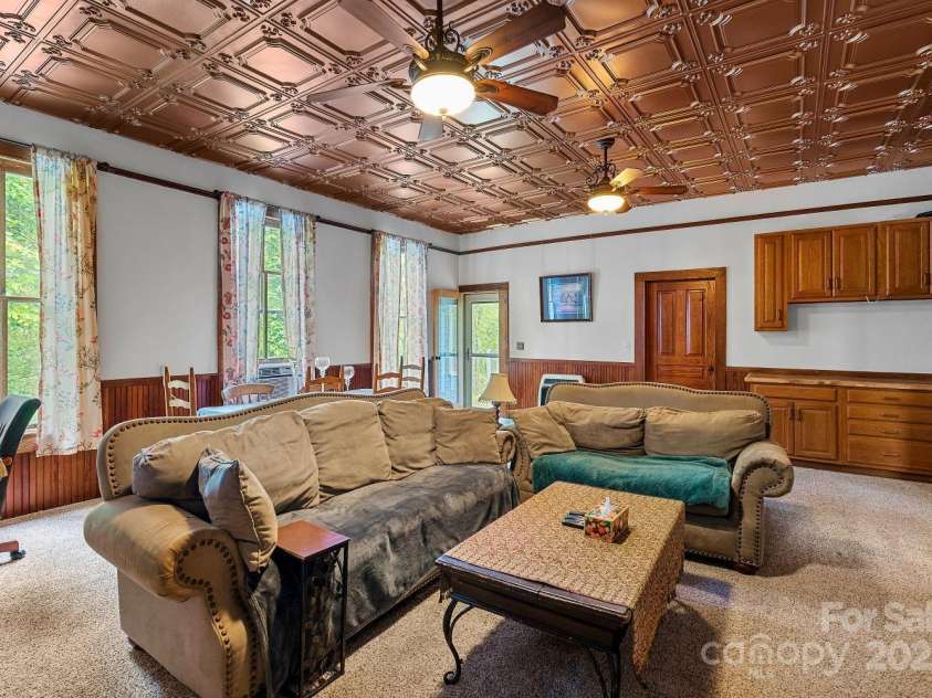 305 Ficker Circle, Hendersonville, NC 28739.  MLS# CAR4240043, YatesRealty ID 3831. Large living room with spectacular tin ceiling, recently installed.