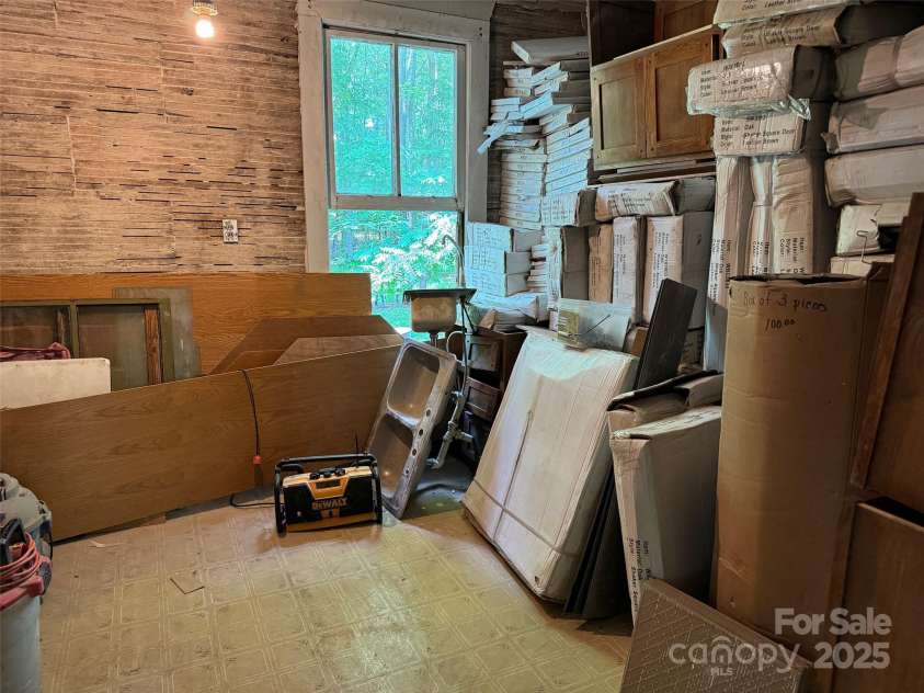 305 Ficker Circle, Hendersonville, NC 28739.  MLS# CAR4240043, YatesRealty ID 3831. Many cottage materials convey with purchase, including cabinets, sinks, shower.