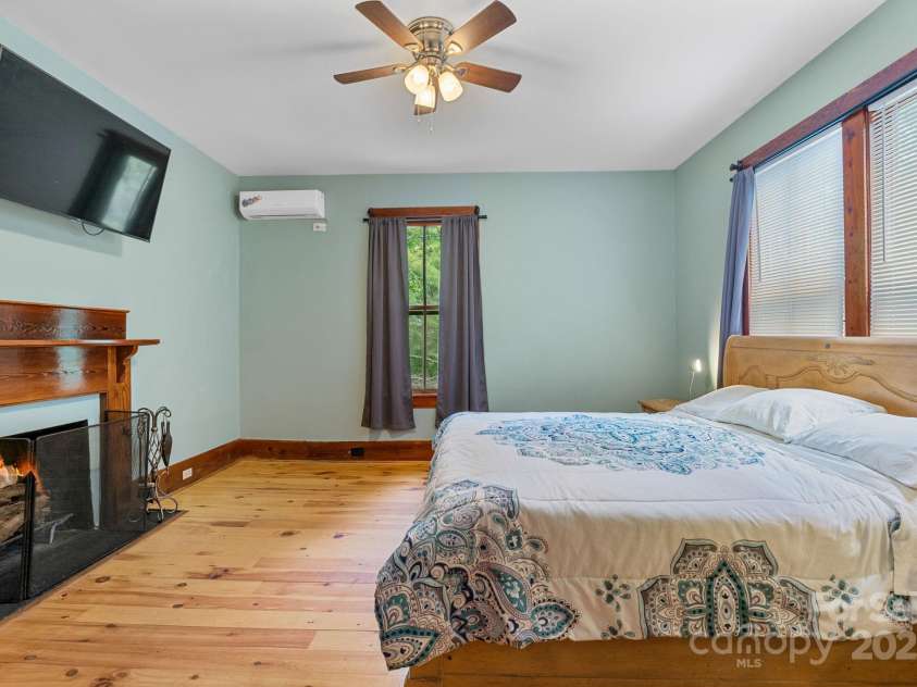 305 Ficker Circle, Hendersonville, NC 28739.  MLS# CAR4240043, YatesRealty ID 3831. Second-floor bedroom suite with walkthrough to full bath.