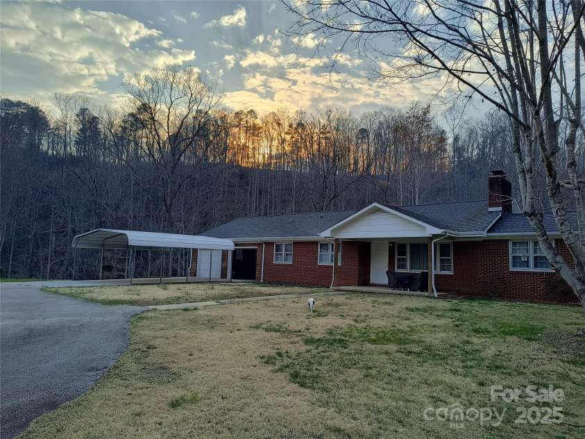 358 Carson Elliott Drive, Marion, NC 28752.  MLS# CAR4240915, YatesRealty ID 3832. House and property in background