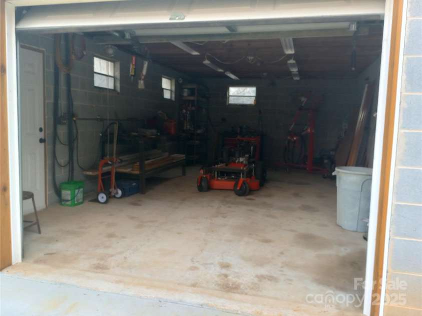 358 Carson Elliott Drive, Marion, NC 28752.  MLS# CAR4240915, YatesRealty ID 3832. Inside garage/ workshop