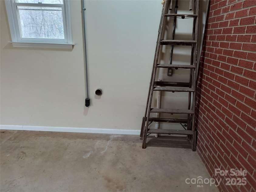 358 Carson Elliott Drive, Marion, NC 28752.  MLS# CAR4240915, YatesRealty ID 3832. Washer and dryer hook up in garage