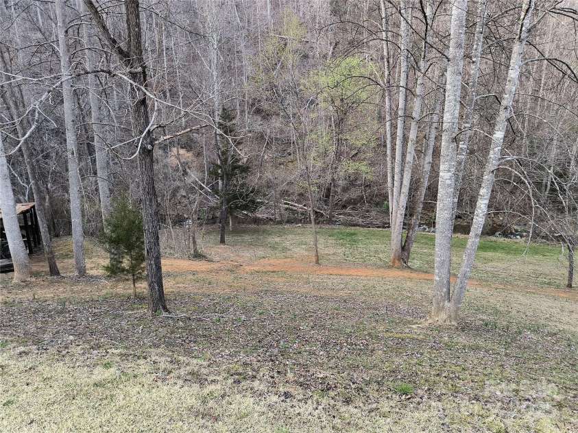 358 Carson Elliott Drive, Marion, NC 28752.  MLS# CAR4240915, YatesRealty ID 3832. Yard and creek