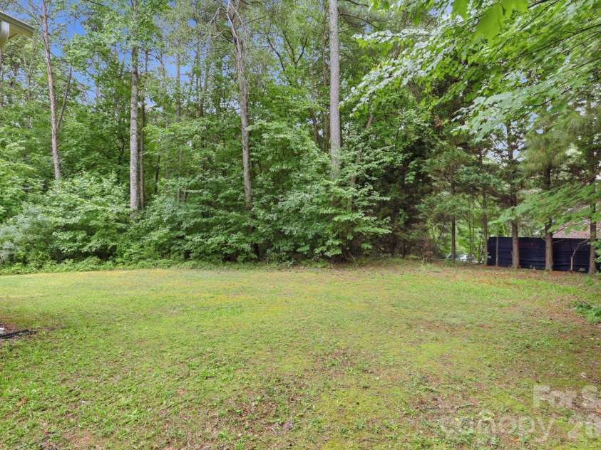3652 Burton Street, Sherrills Ford, NC 28673.  MLS# CAR4390291, YatesRealty ID 38321. Flat usable backyard bordered by mature trees for exceptional privacy.