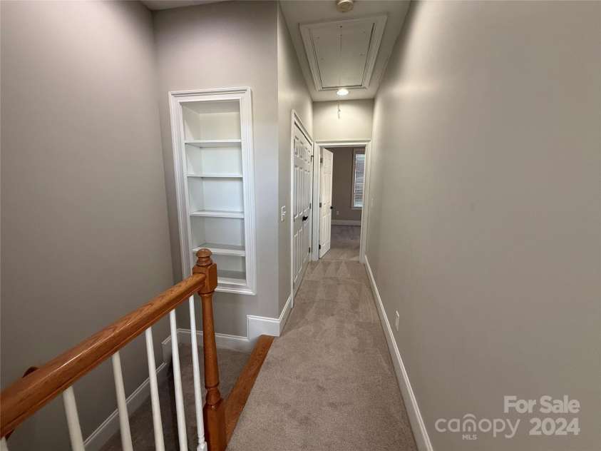 5773 Village Drive, Concord, NC 28027.  MLS# CAR4200719, YatesRealty ID 3833. Upstairs hall way with laundry in the hall way