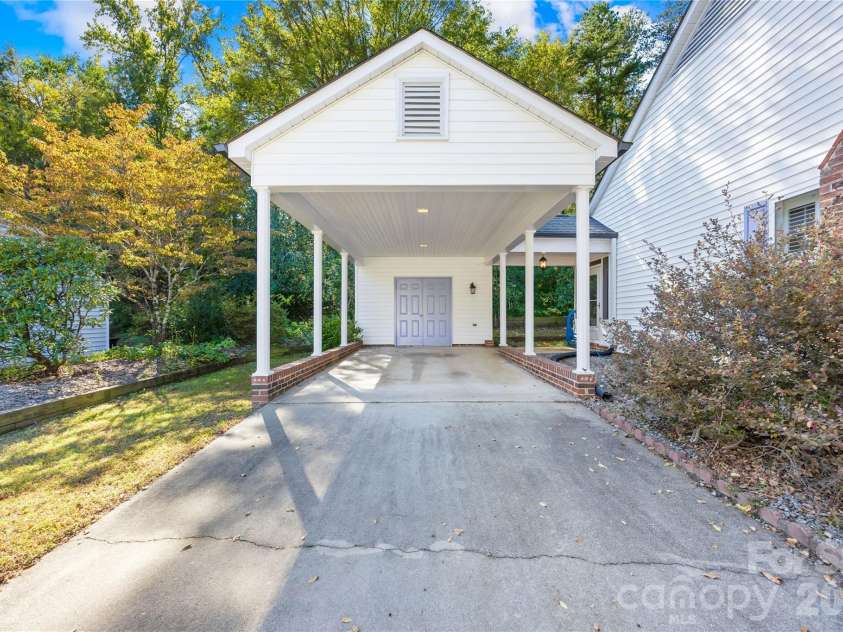 477 Birchwood Trail, Concord, NC 28025.  MLS# CAR4435426, YatesRealty ID 38353. Carport