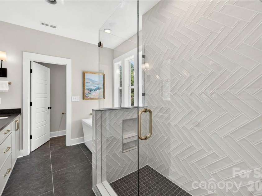3940 Admiral Avenue, Charlotte, NC 28205.  MLS# CAR4378548, YatesRealty ID 38372. Primary bath with walk-in shower