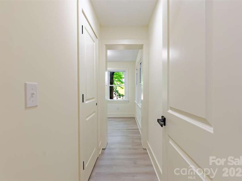 1501 Mccormick Avenue, Gastonia, NC 28054.  MLS# CAR4396541, YatesRealty ID 38376. Shared hallway between primary and secondary bedroom