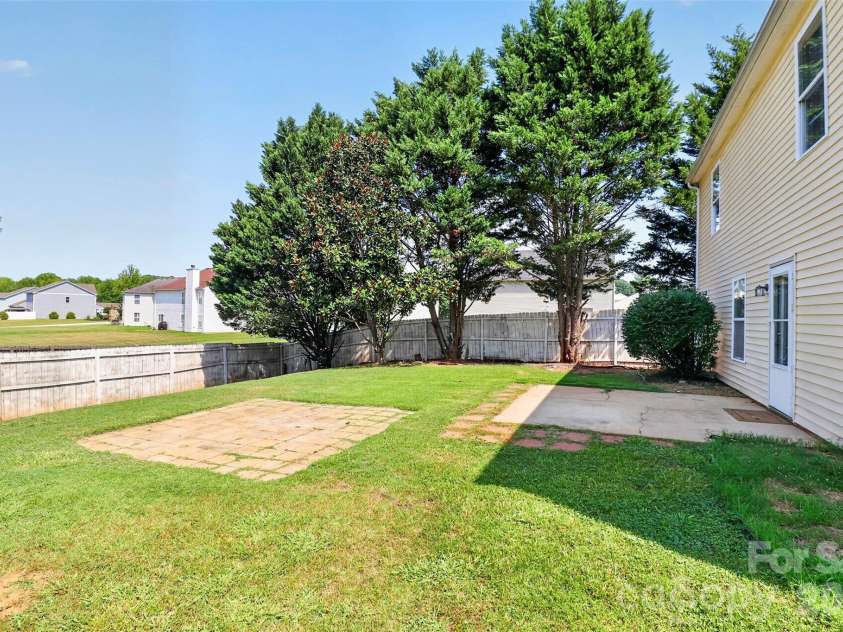 209 Farm Springs Drive, Mount Holly, NC 28120.  MLS# CAR4401410, YatesRealty ID 38377. Backyard/ side view