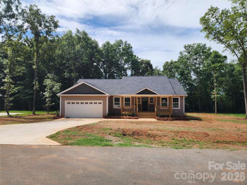 1940 Friendly Lane, Newton, NC 28658.  MLS# CAR4405363, YatesRealty ID 38380. Front Elevation w/ Large Covered Front Porch and Decorative Landscaping