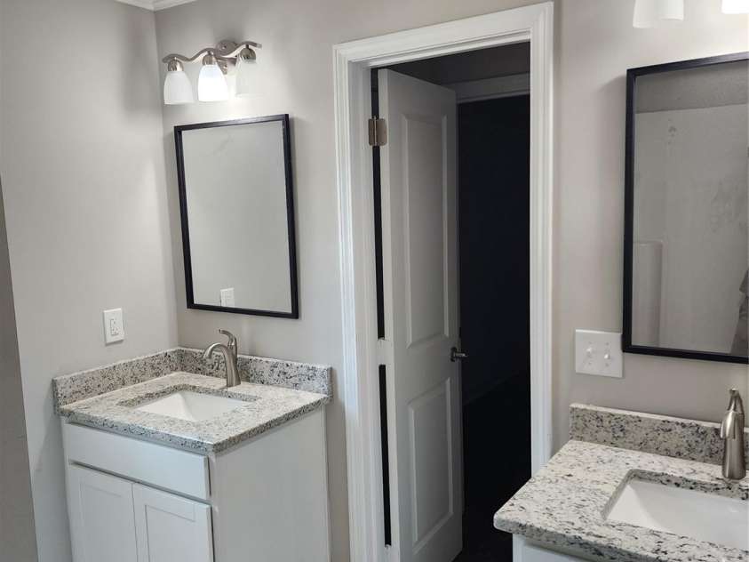 1940 Friendly Lane, Newton, NC 28658.  MLS# CAR4419690, YatesRealty ID 38380. Master Bath w/Decorative His and Hers Vanity w/Granite Tops, Undermount Sinks and Tile Floor